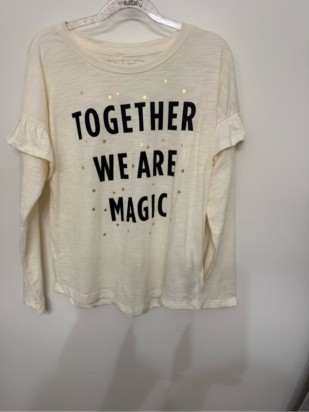 Old Navy Cream Long-Sleeve Tee with Black Text and Gold Stars